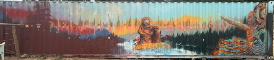 Shipping container mural with dancer silhouettes